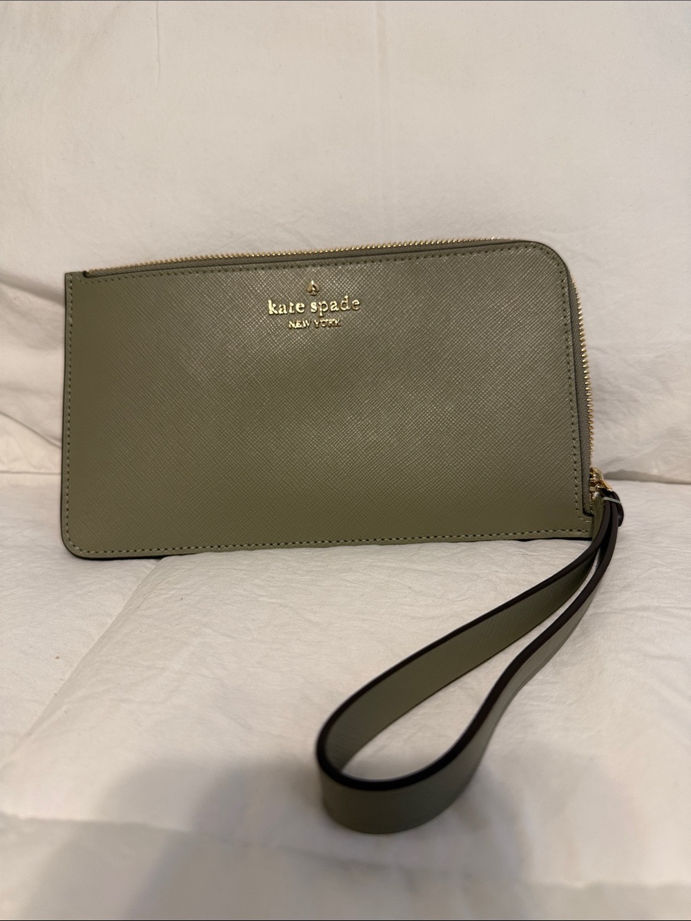 kate spade olive green wristlet wallet with gold logo